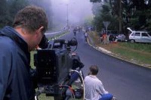 broadcasters in street covering news