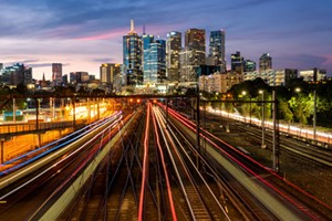 night photo of city with blurred lights representing broadband