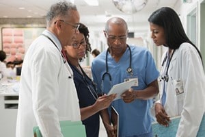 hospital staff looking at tablet
