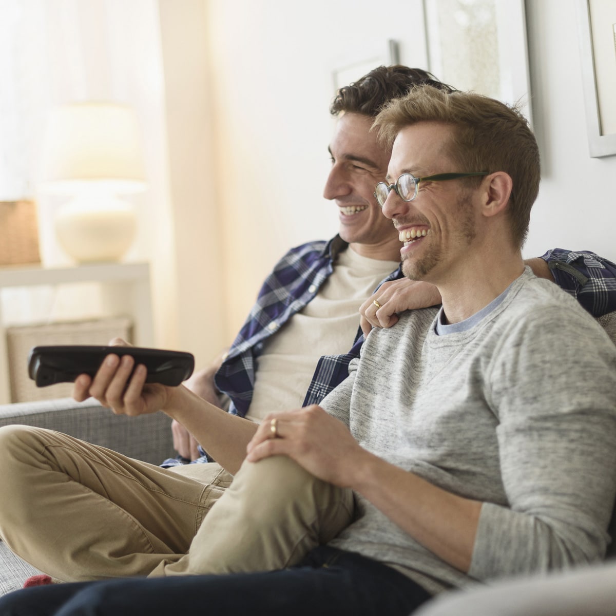 two men watching cable tv