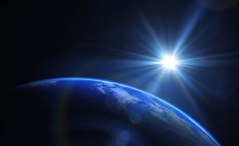 sun coming over earth