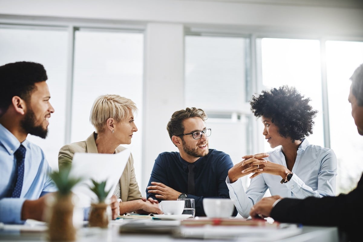 group of rotational associate employees around a table