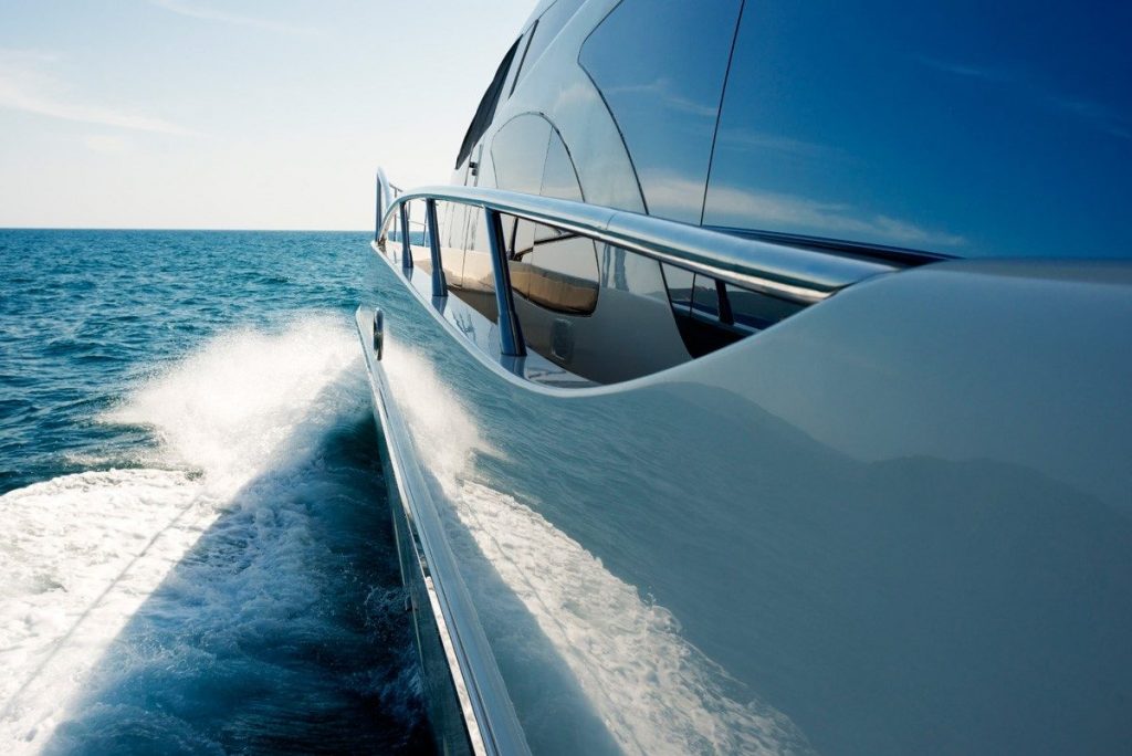 pesonal yact cutting through sea