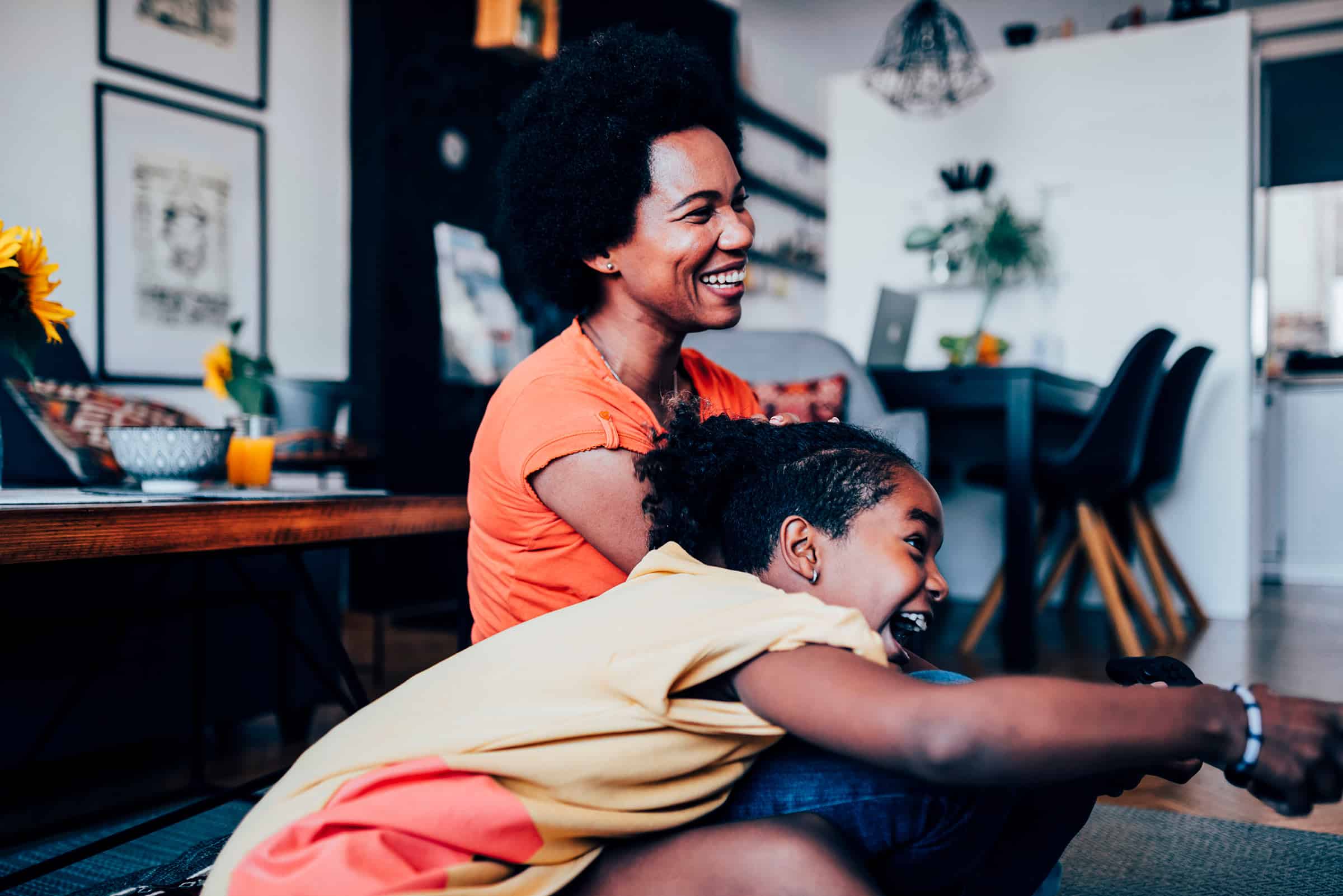 mother and daughter playing video games