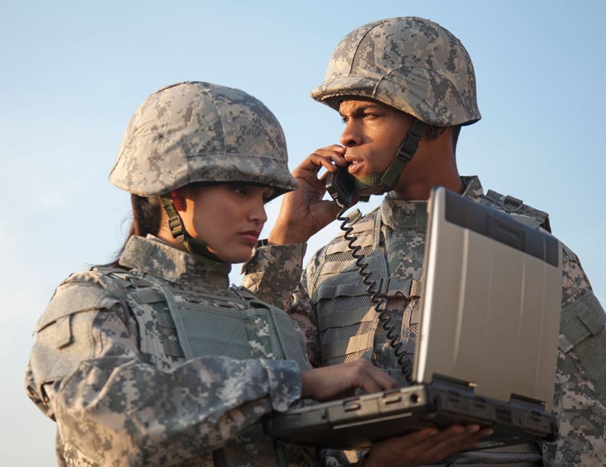 male and female soldiers on satcom equipment