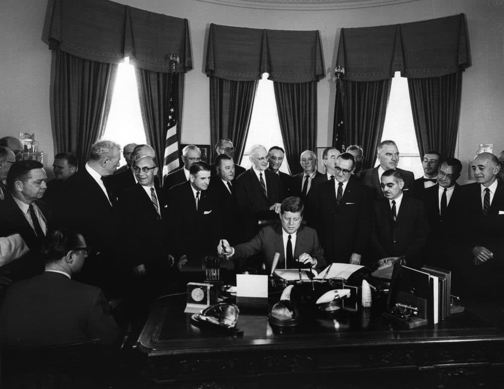 president john f kennedy signs communications satellite act 1962