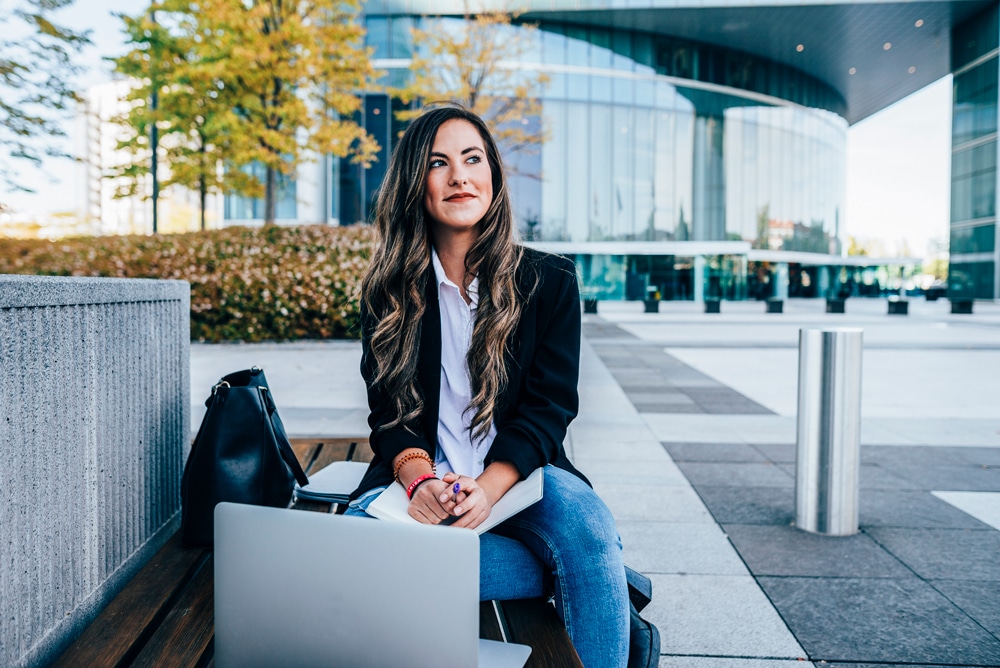 woman-outside-bench-laptop-G-1182546042