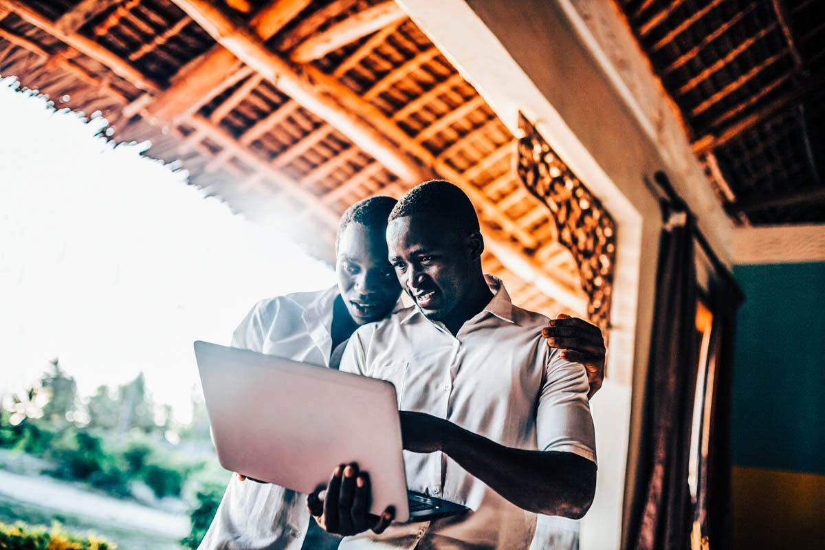 men working on laptop