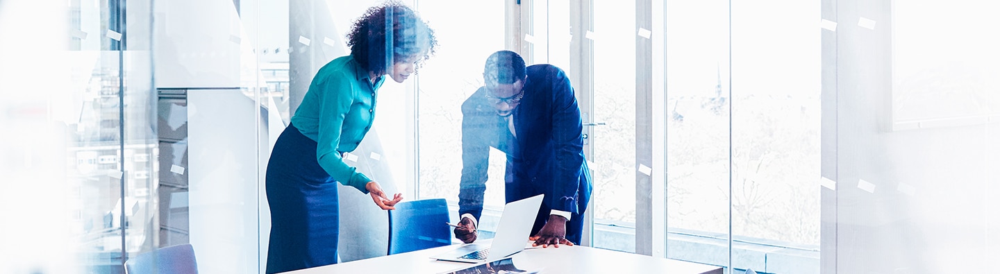 man and woman at meeting