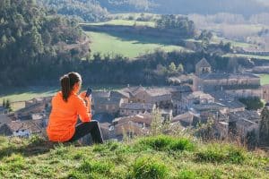 woman on phone overlooking town