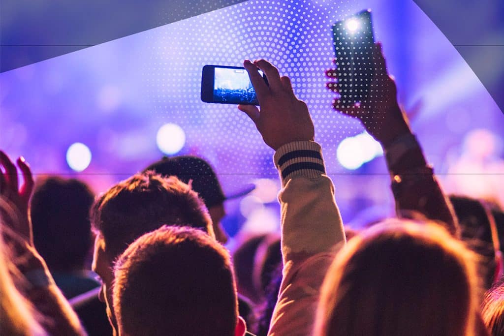 crowd at concert using phones