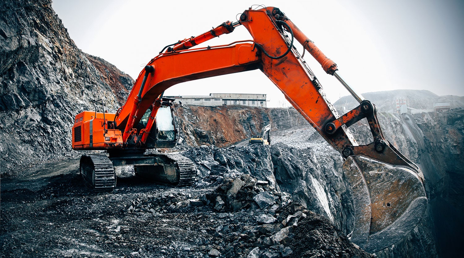 excavator working at mineral quarry