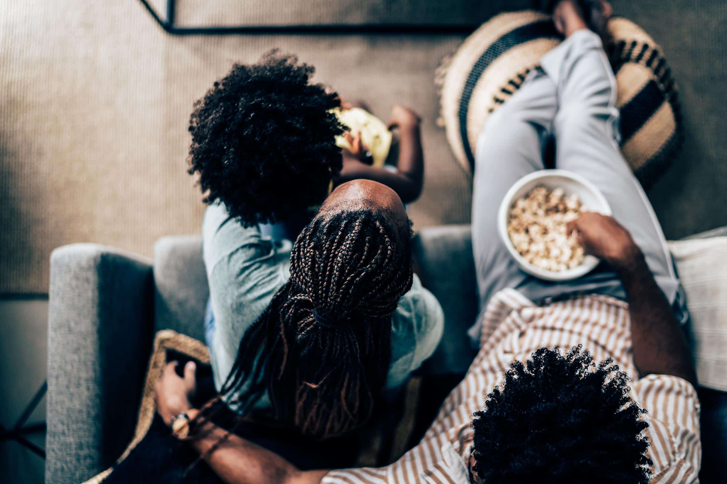family watching tv popcorn