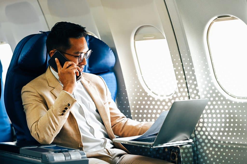 business professional working on a plane