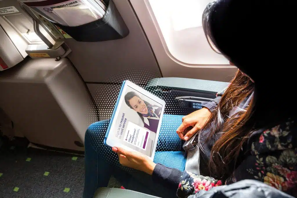 woman using inflight internet