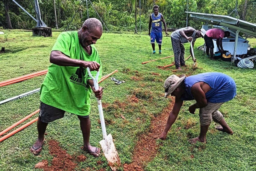Workers in the Solomon Islands improving satellite connectivity